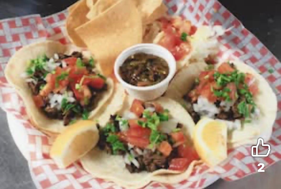 Carne asada street tacos with fresh salsa and lime